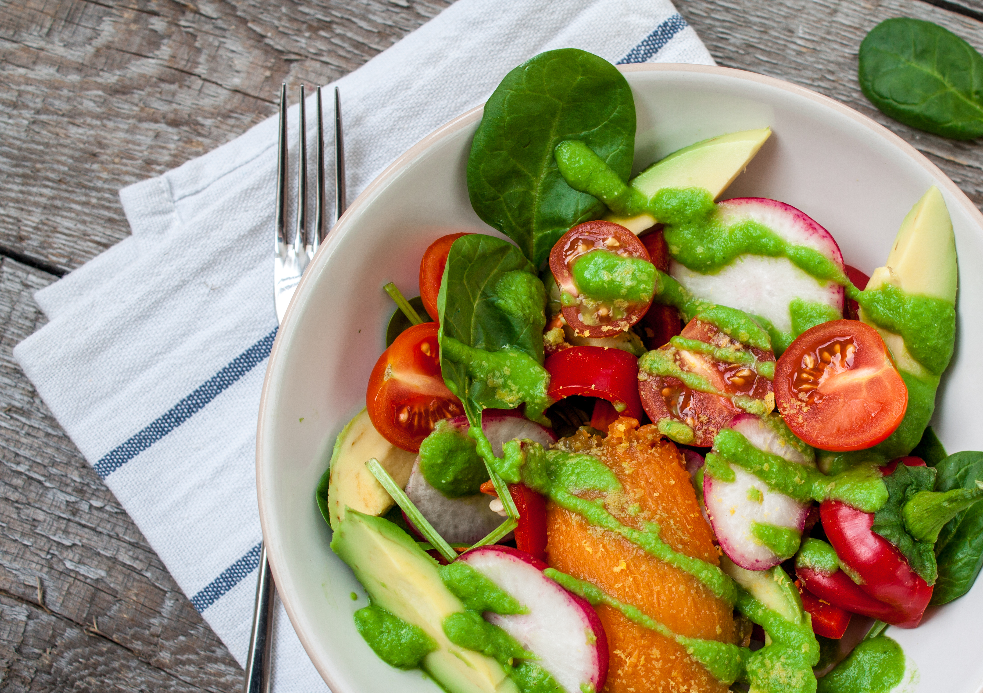 You can create a salad just like this with Frog Song Organics' beautiful local leafy greens, radishes, sweet potatoes, and more!