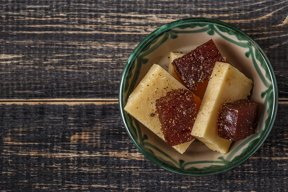 Image of membrillo, which is made from Quince, and served with manchego cheese.