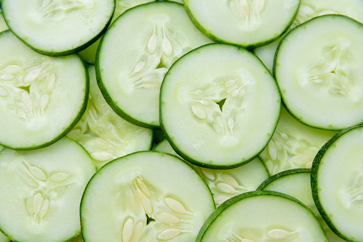 A close up of sliced cucumbers.