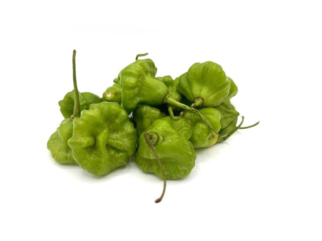 Green cachucha peppers on a white background.