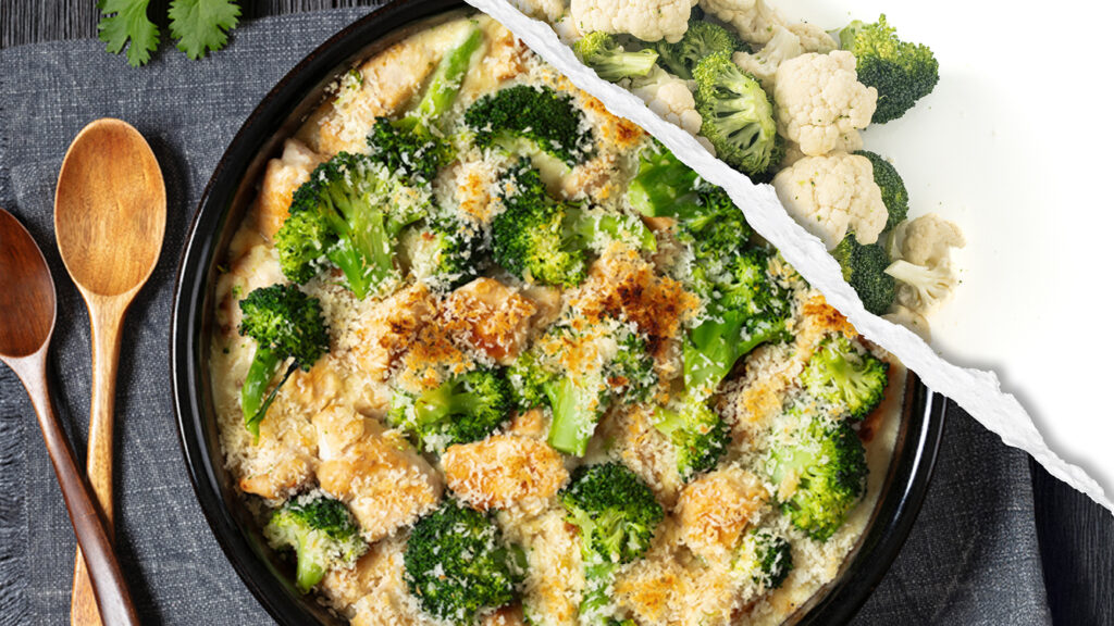 A plated dish of Chicken Divan next to a wooden spoon featuring raw broccoli and cauliflower. 