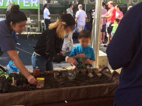 Ag Students planting seeds with kids—FreshPoint Central California