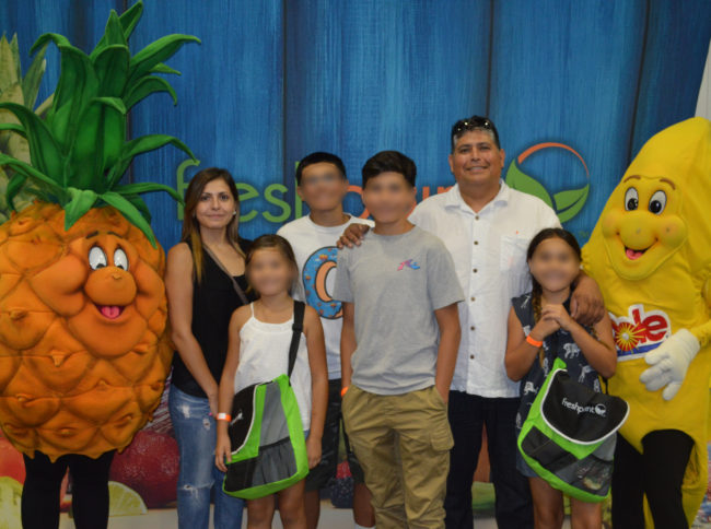 All Smiles with Jaimes Family—FreshPoint Central California—Family Fun Day-blur