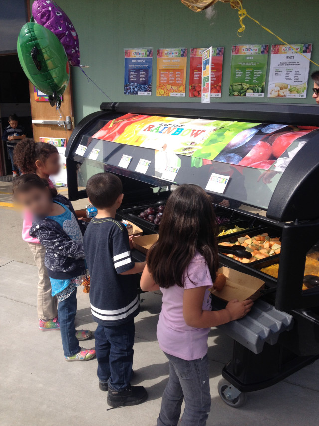 Students try FreshPoint's Eat the Rainbow salad bar at Elmer Wood Elementary school with Sodexo