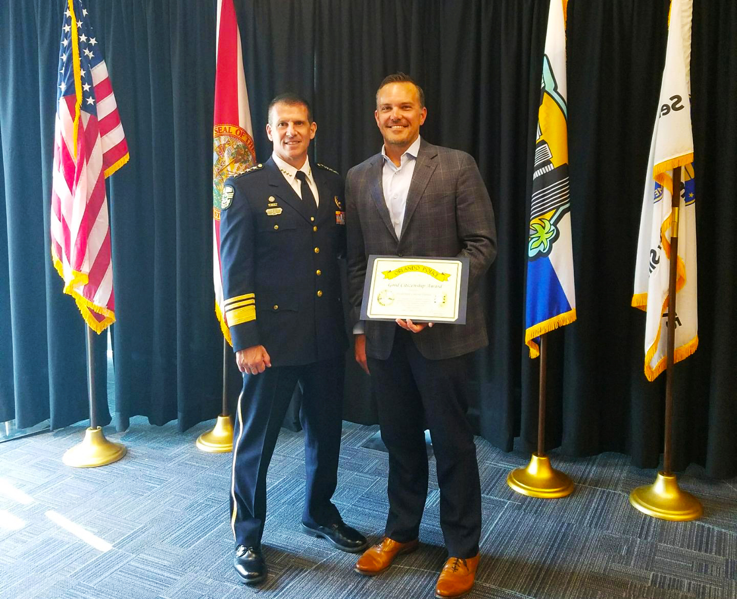 FreshPoint Central Florida Preston Fletcher receiving the Good Citizenship Award from The Orlando Police Department.